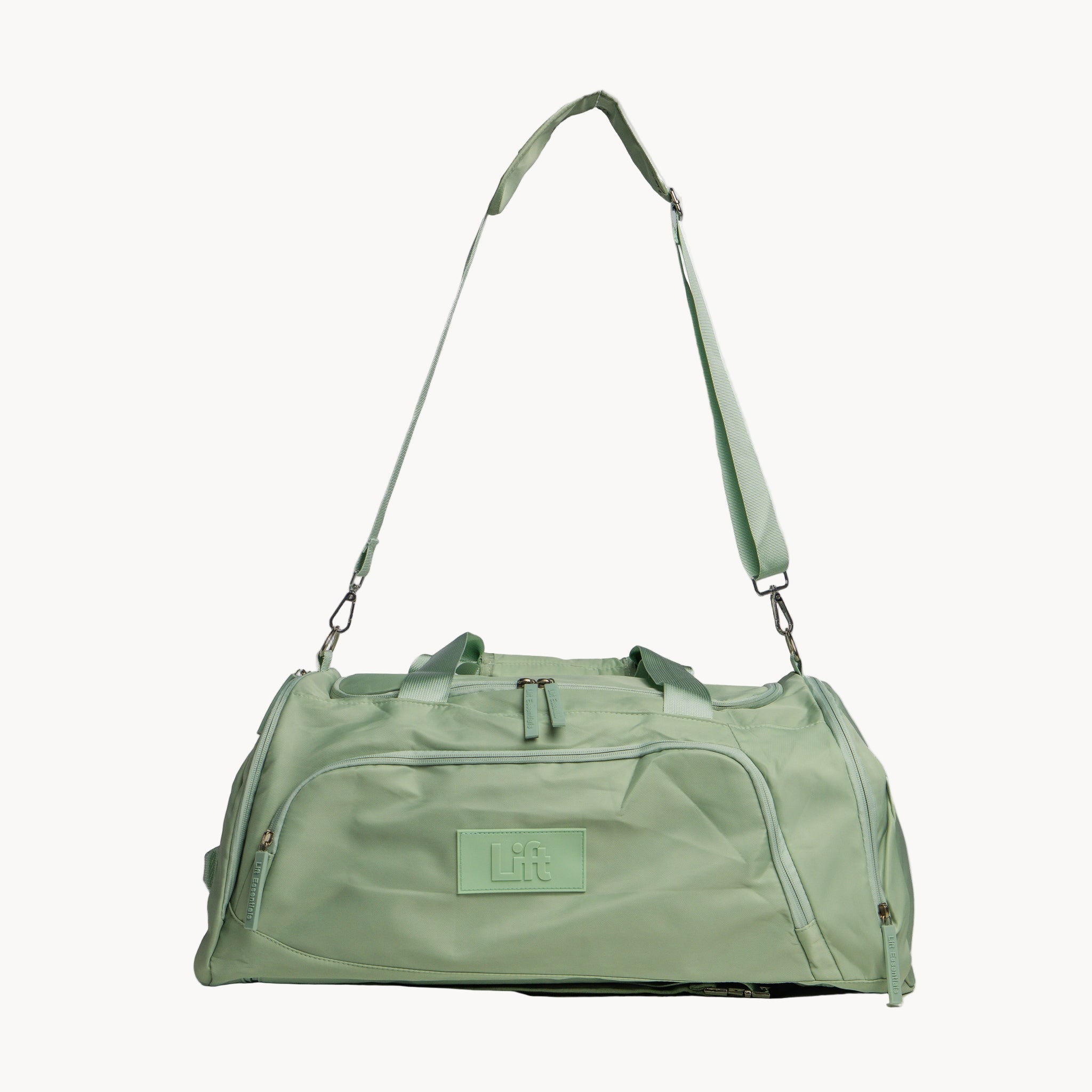 Green duffel bag with a visible brand logo on a white background