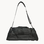 Black duffel bag with shoulder strap on a white background