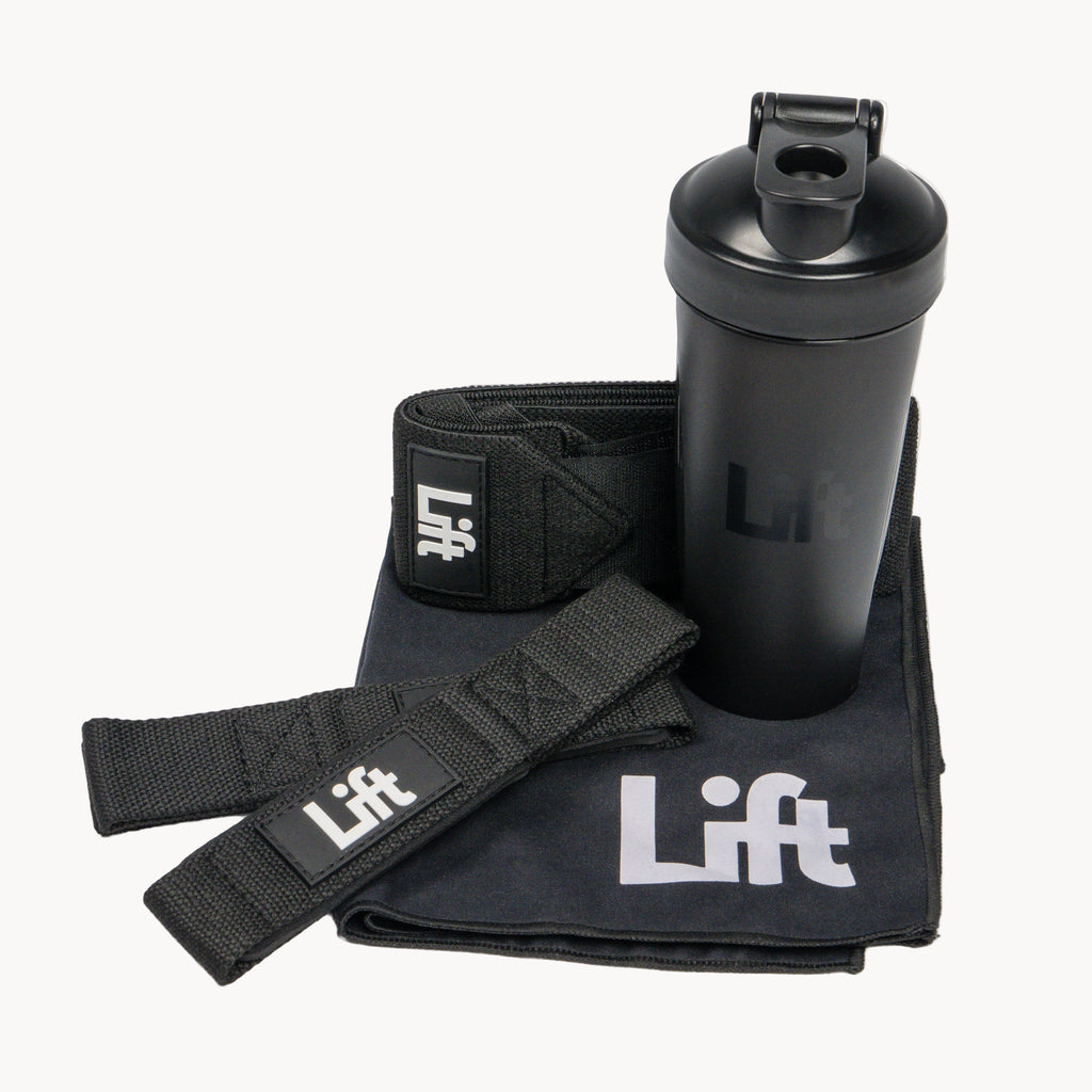 Black shaker bottle, wrist wraps, and towel with 'Lift' branding on a white background