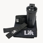Black shaker bottle, wrist wraps, and towel with 'Lift' branding on a white background